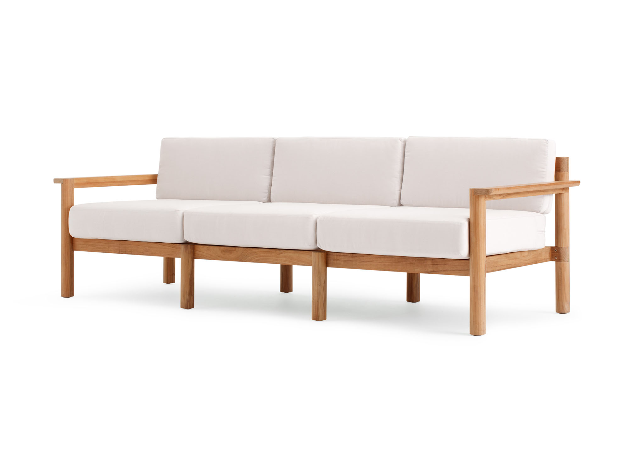 Front angle view of outdoor sofa with white cushions